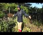 Mara wearing only a hot rain jacket and rubber boots lingering in the garden taking a shower (Video)