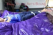 Samantha tied and gagged on bed wearing a shiny darkblue nylon rain pants and a light blue rain jacket (Pics)