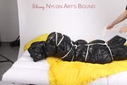 Jill tied and gagged in an big shiny down bag to lie in (Pics)