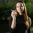 Beautiful Yulia is smoking all white cigarette