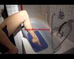 Watching Sandra wearing a sexy blue shiny nylon shorts and a top while playing with water in her bath tub (Video)