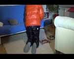 Mara sorting newspapers and lolling on the floor and the sofa wearing sexy shiny nylon downwear (Video)