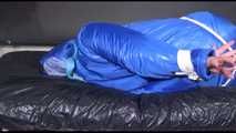 Lucy tied and gagged with ropes on bed wearing sexy blue oldschool downwear (Video)