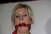 Sexy Lucy tied an gagged with ropes and a cloth gag wearing a super hot red shiny nylon shorts and a yellow rain jacket (Pics)