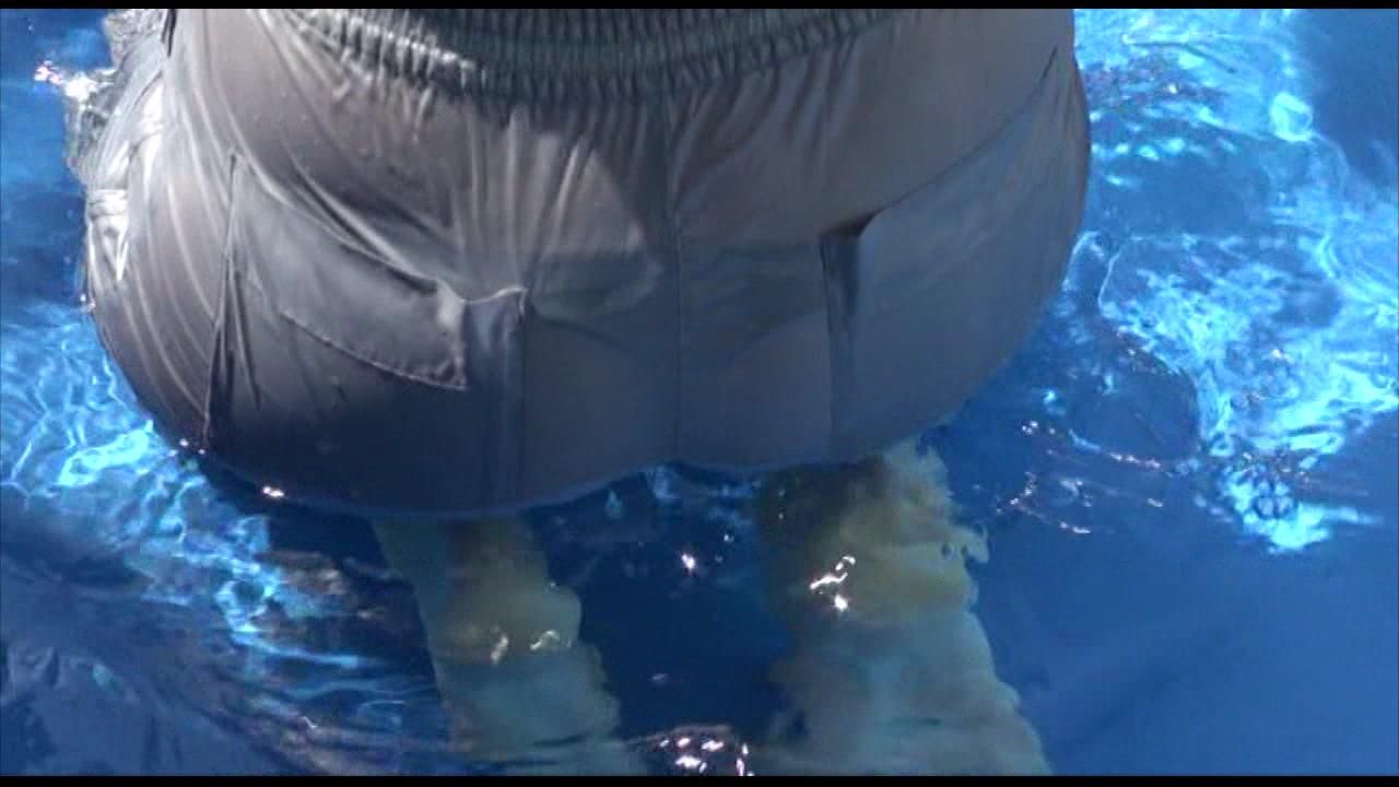Pia Ties And Gagges Herself In A Small Swimming Pool Wearing Sexy Grey Rainwear (Video)