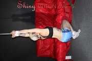 Watching ***NEW MODELL COURTNEY*** wearing a sexy lightblue shiny nylon shorts and a black top being tied and gagged overhead with ropes and a ballgag (Pics)