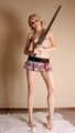 Topless barefoot Hannah, handcuffed and legcuffed with steel restraints, poses for the camera
