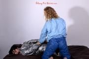 Jill tied and gagged by Sophie wearing shiny PVC suits (Pics)