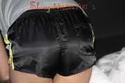 Watching Pia preparing her bed wearing a sexy black shiny nylon shorts and a grey tshirt (Pics)