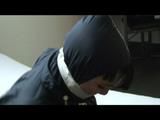 04:30 Min. video with Jill tied and gagged in shiny nylon rainwear