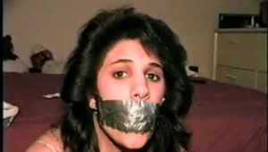 19 Yr OLD LATINA HOUSEWIFE IS BALL-TIED WITH TAPE AND ROPE TAPE GAGGED, CLEAVE GAGGED AND BLINDFOLDED WEARING LINGERIE  (D60-3)