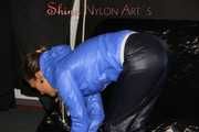 Sexy Sandra wearing a supersexy black shiny nylon rain pants and a sexy shiny blue rain jacket lolling on the sofa (Pics)