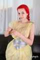 Morrigan - posing in yellow trash bag dress