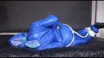 Lucy tied and gagged with ropes on bed wearing sexy blue oldschool downwear (Video)